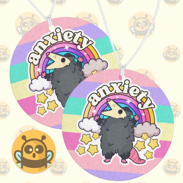 This image shows an adorable hand-drawn air freshener, Anxiety Rainbow Possum Air Freshener, which is available to purchase from HunnieByte.com