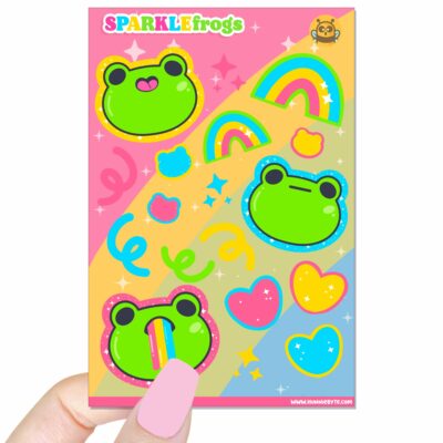 This image shows an adorable hand-drawn sticker sheet, Sparkle Frogs Sticker Sheet, which is available to purchase from HunnieByte.com