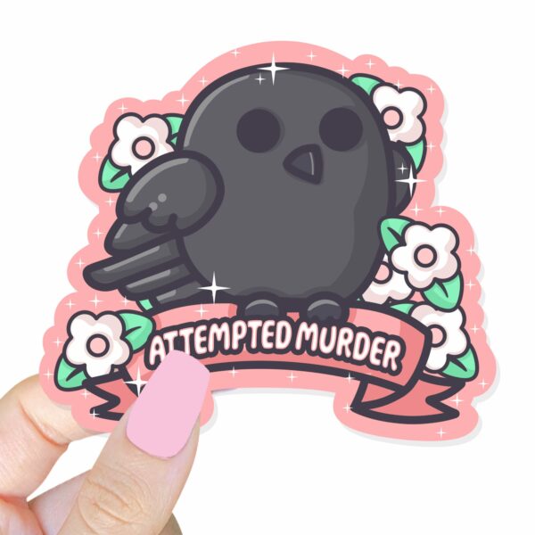 This image shows an hand-drawn adorable sticker, Attempted Murder Crow Sticker, which is available to purchase from HunnieByte.com