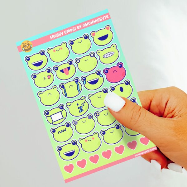 This image shows an adorable hand-drawn sticker sheet, Frog Emojis Sticker Sheet, which is available to purchase from HunnieByte.com