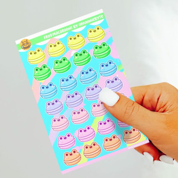 This image shows an adorable hand-drawn sticker sheet, Rainbow Frog Macaroons Sticker Sheet, which is available to purchase from HunnieByte.com