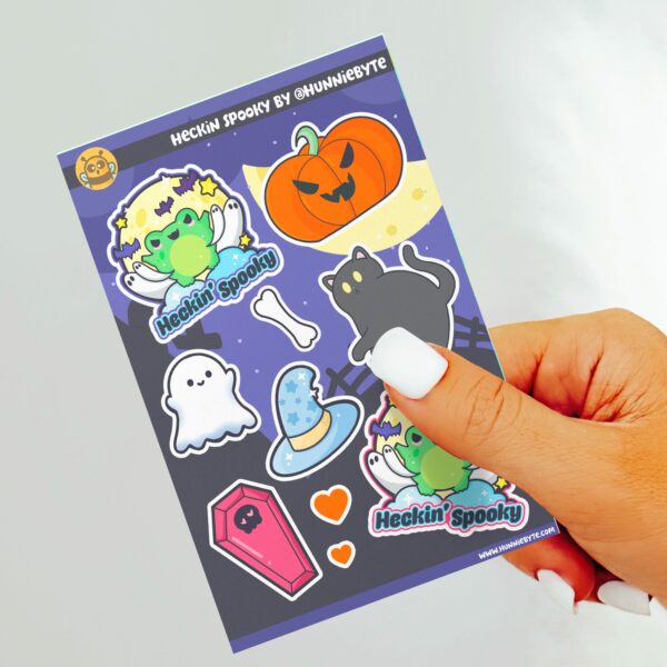 This image shows an adorable hand-drawn sticker sheet, Heckin Spooky Sticker Sheet, which is available to purchase from HunnieByte.com