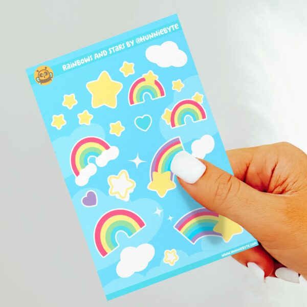 This image shows an adorable hand-drawn sticker sheet, Rainbows and Stars Sticker Sheet, which is available to purchase from HunnieByte.com