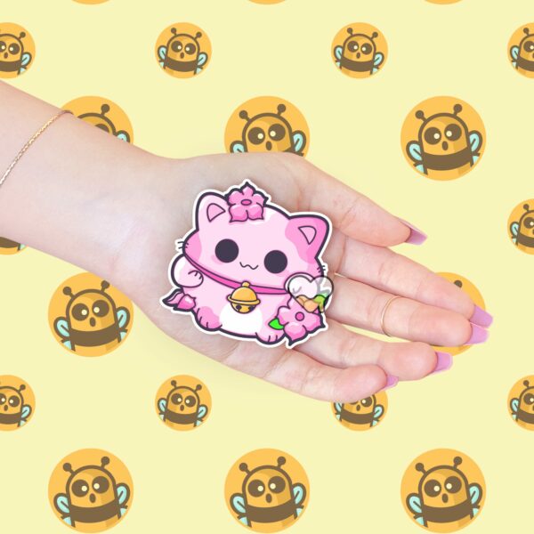 This image shows an hand-drawn adorable sticker, Pink Lotus Lucky Cat Sticker, which is available to purchase from HunnieByte.com