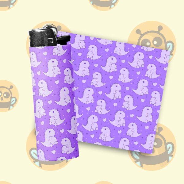 This image shows an adorable hand-drawn lighter wrap, Cute Dinos Lighter Wraps, which is available to purchase from HunnieByte.com